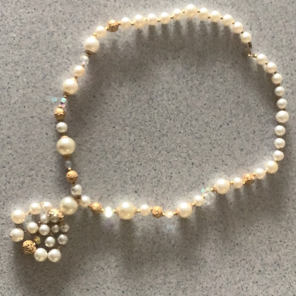 Faux pearl, filigree gold color beads accented with crystals